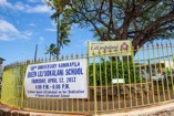 Queen Lili`uokalani School's Front Gate with Banner Announcing the 100th Anniversary Event