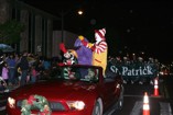 Ronald McDonald and his crew wave to the crowd at the Kaimuki Christmas Parade