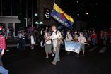 Boy Scouts wave as they march along the Kaimuki Christmas Parade 2011