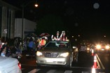 Participants wave to the crowd during the Kaimuki Christmas Parade 2011