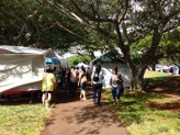 Craft fair shoppers walking along Kapiolani Community College