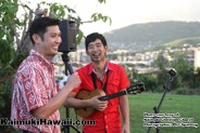 Kaimuki resident Jake Shimabukuro and best friend Jeff Lau help light the Kaimuki Christmas Tree