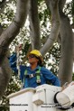 Tihana Kekauoha, an apprentice line(wo)man, puts up a snowflake Christmas light at the Kaimuki playground.