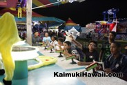 Aiming for the prize at the Water Race, Kaimuki Carnival 2016