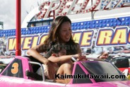 Mom and daughter enjoying the Speedway ride at the Kaimuki Carnival